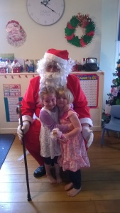 Emersyn and her best bud with Santa at their preschool Christmas party